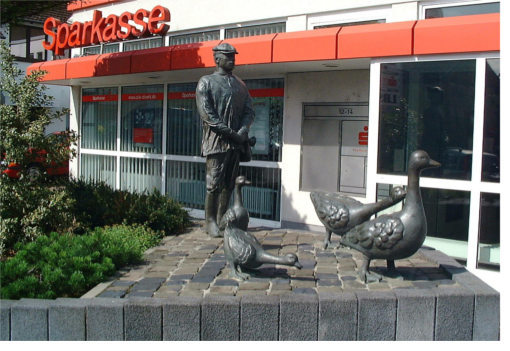 Sculptural group geese with Shepherd